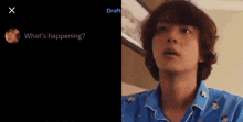 a man in a blue shirt is being asked what 's happening on a screen