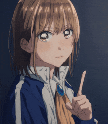 a girl in a blue and white jacket is pointing her finger