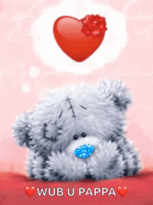 a teddy bear says wub u pappa in front of a heart