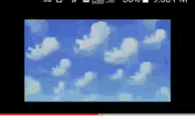 a computer screen shows a blue sky with clouds