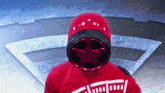 a person wearing a red helmet with a star on it and a shirt that says ' a ' on it