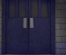a cartoon character is standing in a doorway in a dark room .