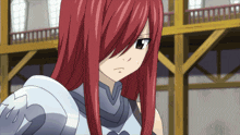 a girl with red hair is wearing a silver armor and looking at the camera
