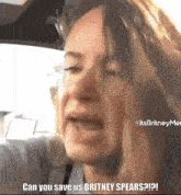 a woman in a car says " can you save us britney spears ? "