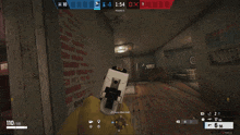a screenshot of a video game shows a room with a brick wall and a person holding a gun
