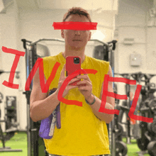 a man in a yellow shirt is taking a picture of himself in a gym with the word incel written in red