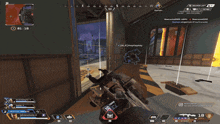 a screenshot of a video game shows a person holding a gun in a room