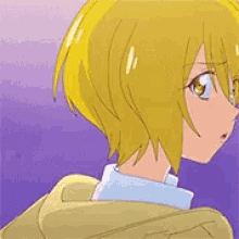 a girl with yellow hair and blue eyes is wearing a white shirt and red tie .
