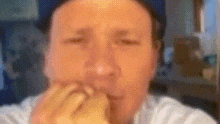 a blurry picture of a man 's face with his eyes closed