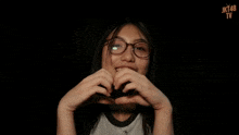 a girl wearing glasses and a shirt that says jkt48