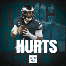 a philadelphia eagles football player holding a ball