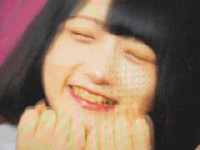 a close up of a woman 's face with her eyes closed and her mouth open