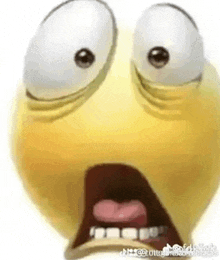 a close up of a cartoon smiley face with big eyes and a surprised look on its face .