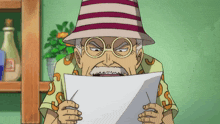 a man with glasses and a hat is holding a piece of paper
