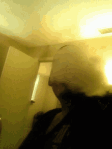 a blurry picture of a person with a hoodie that says ' everlast ' on the front