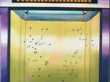 an elevator with bullet holes in the wall