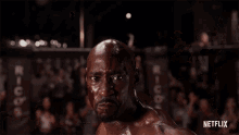 a man in a boxing ring with the word netflix on the bottom right
