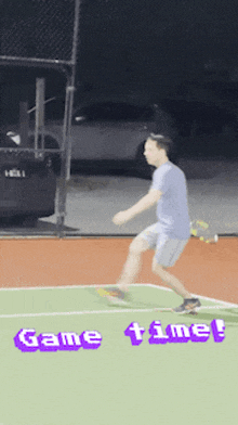 a man is jumping in the air on a tennis court with the words game time on the bottom