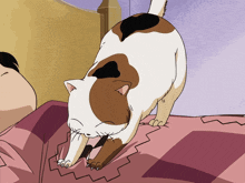 a brown and white cat laying on a bed