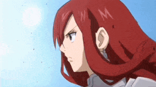 a close up of a person 's face with red hair .
