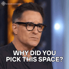 a man wearing glasses is asking why did you pick this space