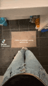 a tiktok video of a person standing on a tile floor