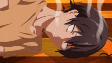 a person laying on a wooden floor with a smoke coming out of their mouth