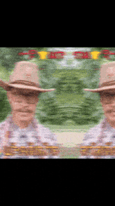a blurry picture of a man wearing a cowboy hat and glasses