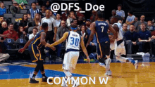 a basketball player with the number 30 on his jersey dribbles the ball