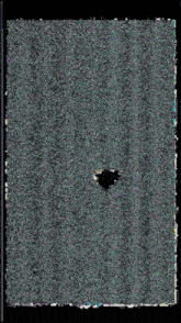 a black hole in the middle of a gray and green carpet