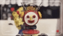 a close up of a clock with a face on it and headphones .