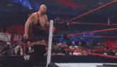 two wrestlers in a wrestling ring with a sign that says hd in the background