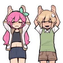 a girl with pink hair and a boy with blonde hair are standing next to each other with their hands in the air .