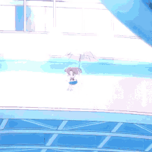 a little girl is holding an umbrella on a bridge
