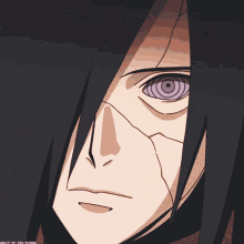 a close up of a person 's face with purple eyes and a crack in his face