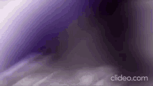 a purple and white background with the words clideo.com in the corner .