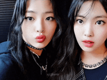 two girls are posing for a picture and the name njsfuerie is on the bottom left