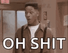 a man is standing in a hallway with his mouth open and the words `` oh shit '' written above him .