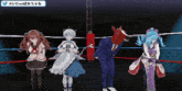 a group of anime characters standing in a boxing ring with a twitter logo in the corner