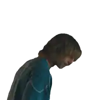 a man with long hair is wearing a blue shirt that says ' nc ' on it