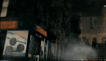 a liquor store is lit up at night