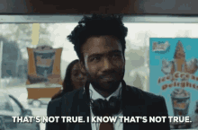 a man wearing headphones says that 's not true i know that 's not true .