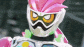 a close up of a cartoon character wearing a pink helmet and goggles .