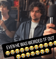 a man holding a microphone with the words even he was weirded tf out