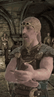 a man with a beard and goggles on his head is in a video game scene