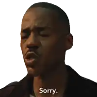 a man with his eyes closed has the word sorry written on his face