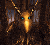 a gold mask with horns and blue eyes is on a person