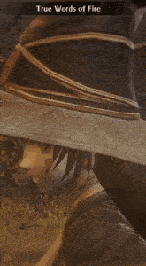 a woman in a witch hat is holding a sword in her hand