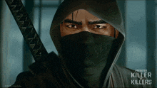 a poster for predator killer of killers shows a man with a hood on