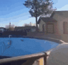 a blurry picture of a house and a pool